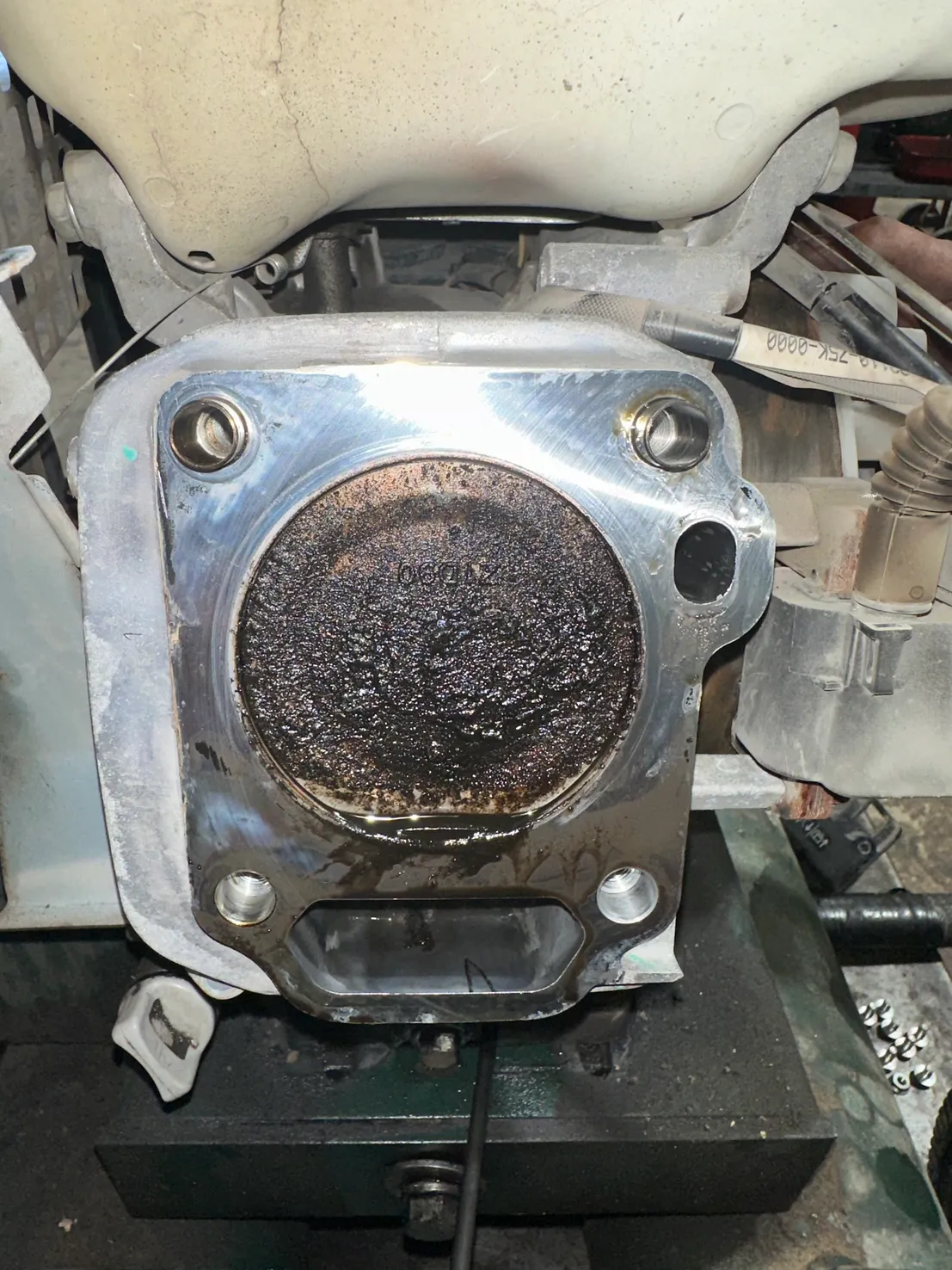 Engine cylinder head carbon buildup